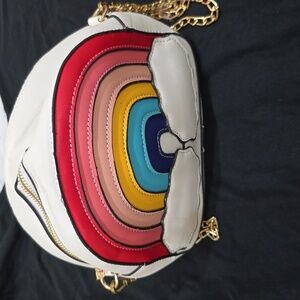 White purse rainbow with clouds